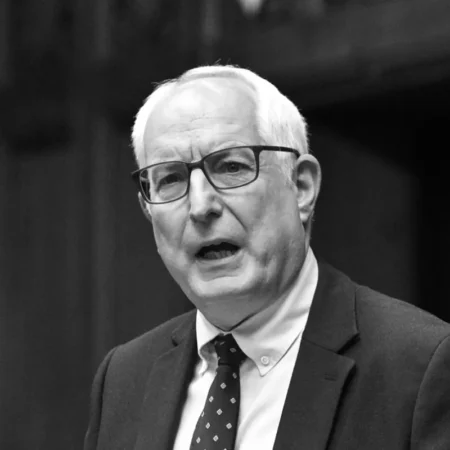 Black-and-white portrait of Neil Duncan-Jordan MP