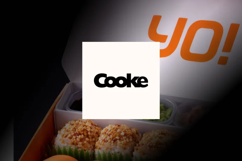 Cooke logo overlaid on a Yo! Sushi takeaway box containing salmon dishes.
