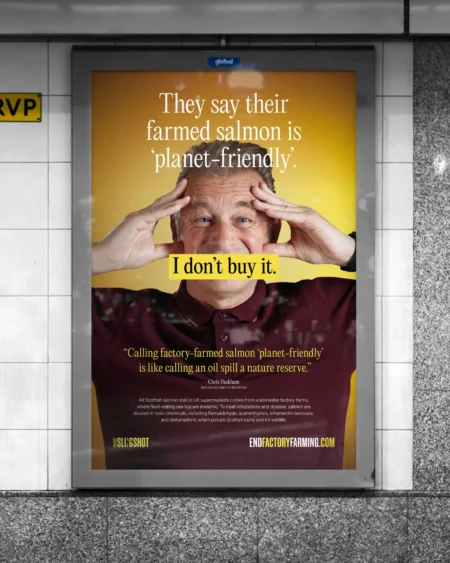 A campaign poster for End Factory Farming displayed in a London Underground station, featuring naturalist and TV presenter Chris Packham and the text "I don't buy it."